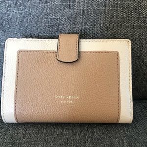 Brown/tan Small Kate spade wallet. Never used. Basically new. No tags.